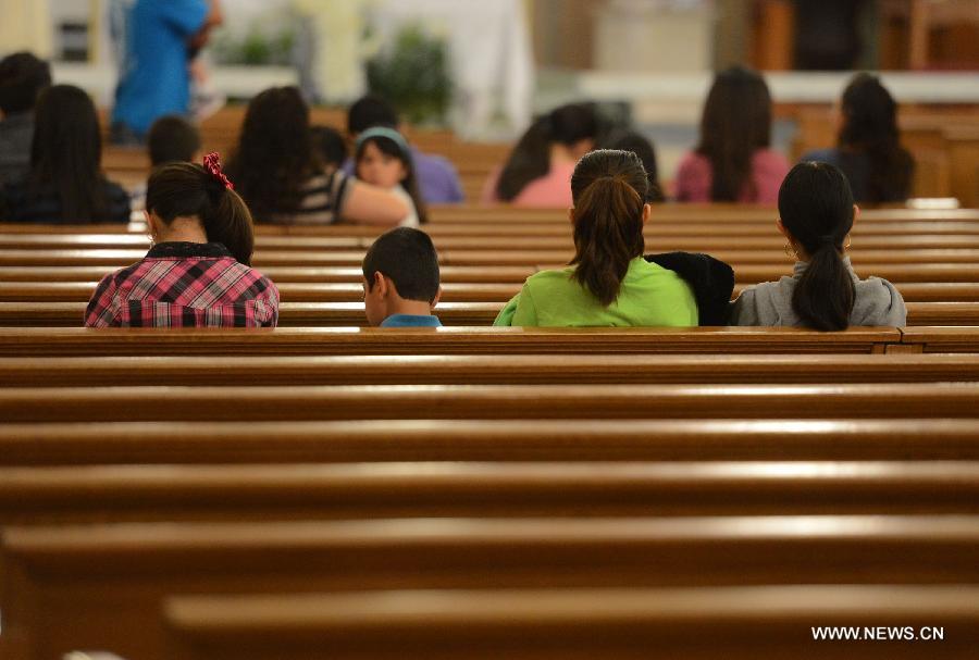 Local residents attend a commemoration ceremony for the deceased people during the furtilizer explosion at a church in West, Texas, April 21, 2013. The powerful blast occurred around 7:50 p.m. local time Wednesday at the fertilizer plant in West, a small town some 320 km north of Houston, Texas, killing at least 14 people and injuring about 200 others. Another 60 remained unaccounted for in the blast, according to local officials. (Xinhua/Wang Lei) 