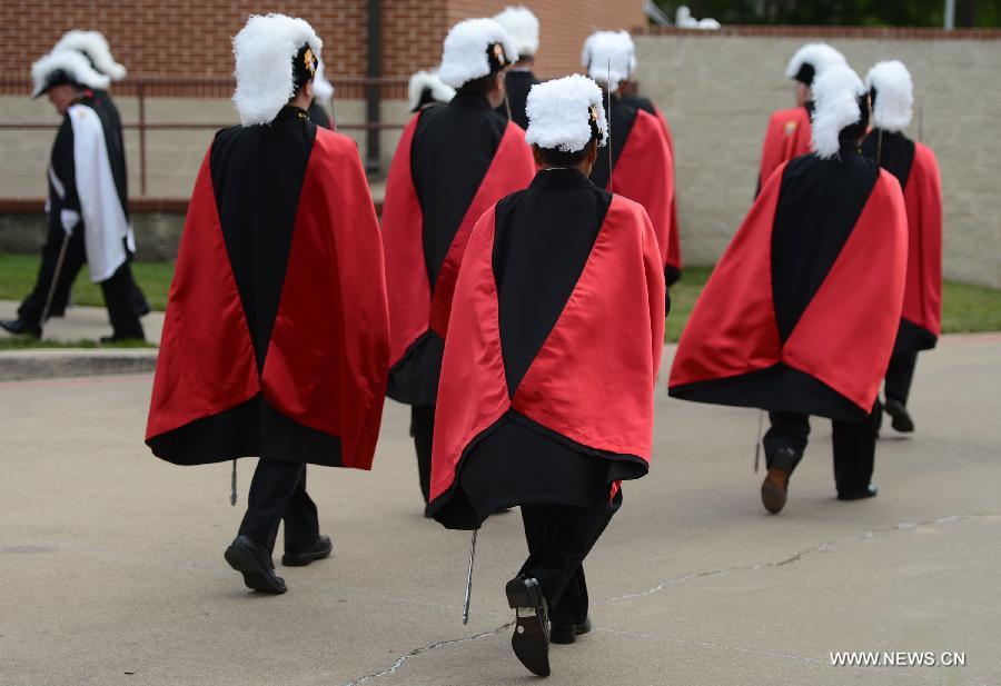 Members of the Knights of Columbus, one of the world's largest Catholic fraternal service organization, participate in a commemoration ceremony for the deceased people during the furtilizer explosion at a church in West, Texas, April 21, 2013. The powerful blast occurred around 7:50 p.m. local time Wednesday at the fertilizer plant in West, a small town some 320 km north of Houston, Texas, killing at least 14 people and injuring about 200 others. Another 60 remained unaccounted for in the blast, according to local officials. (Xinhua/Wang Lei) 