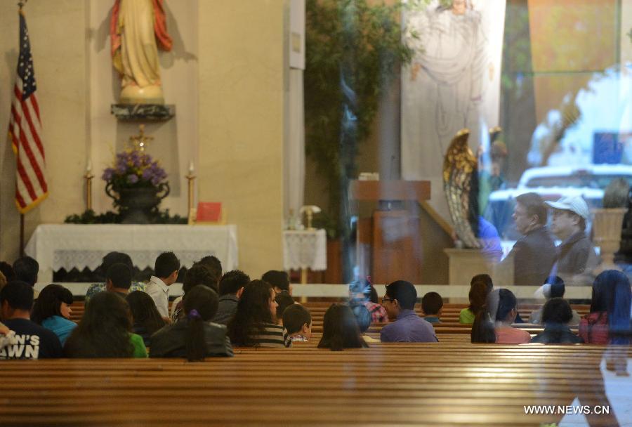 Local residents attend a commemoration ceremony for the deceased people during the furtilizer explosion at a church in West, Texas, April 21, 2013. The powerful blast occurred around 7:50 p.m. local time Wednesday at the fertilizer plant in West, a small town some 320 km north of Houston, Texas, killing at least 14 people and injuring about 200 others. Another 60 remained unaccounted for in the blast, according to local officials. (Xinhua/Wang Lei) 