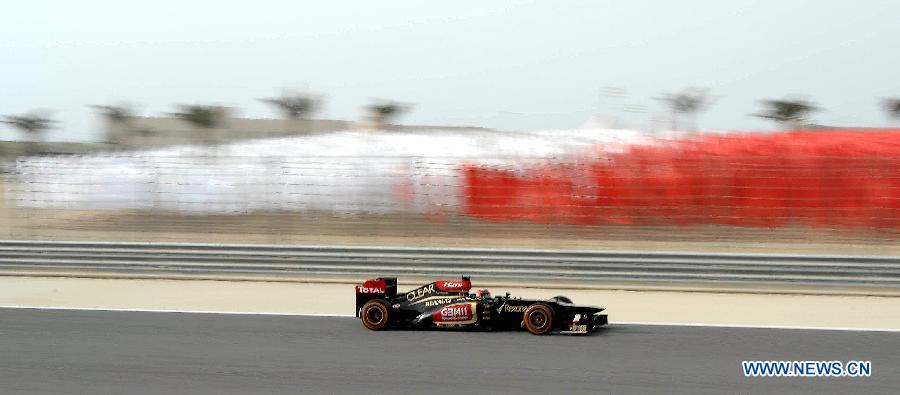 Lotus driver Romain Grosjean drives during the victory ceremony of the Bahrain F1 Grand Prix at the Bahrain International Circuit in Manama, Bahrain, on April 21, 2013. (Xinhua/Chen Shaojin)