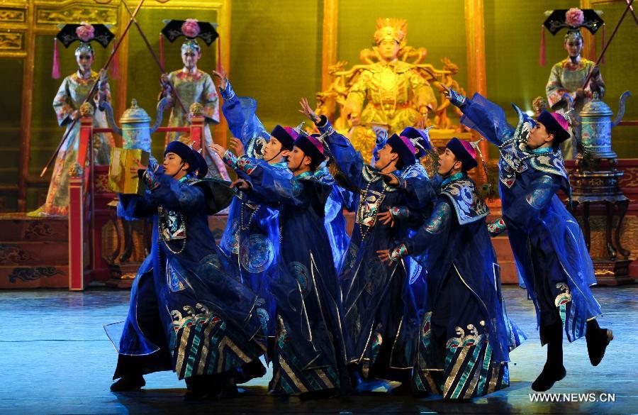 Artists of the Jilin Provincial Performing Troupe perform during a stage show at the Oriental Theatre in Changchun, capital of northeast China's Jilin Province, April 22, 2013. The show, with various art forms including singing, dancing, acrobatics and conjuring, displays folk customs in the Changbai Mountain area. (Xinhua/Xu Chang) 
