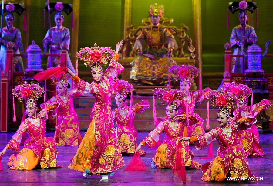 Artists of the Jilin Provincial Performing Troupe perform during a stage show at the Oriental Theatre in Changchun, capital of northeast China's Jilin Province, April 22, 2013. The show, with various art forms including singing, dancing, acrobatics and conjuring, displays folk customs in the Changbai Mountain area. (Xinhua/Xu Chang) 