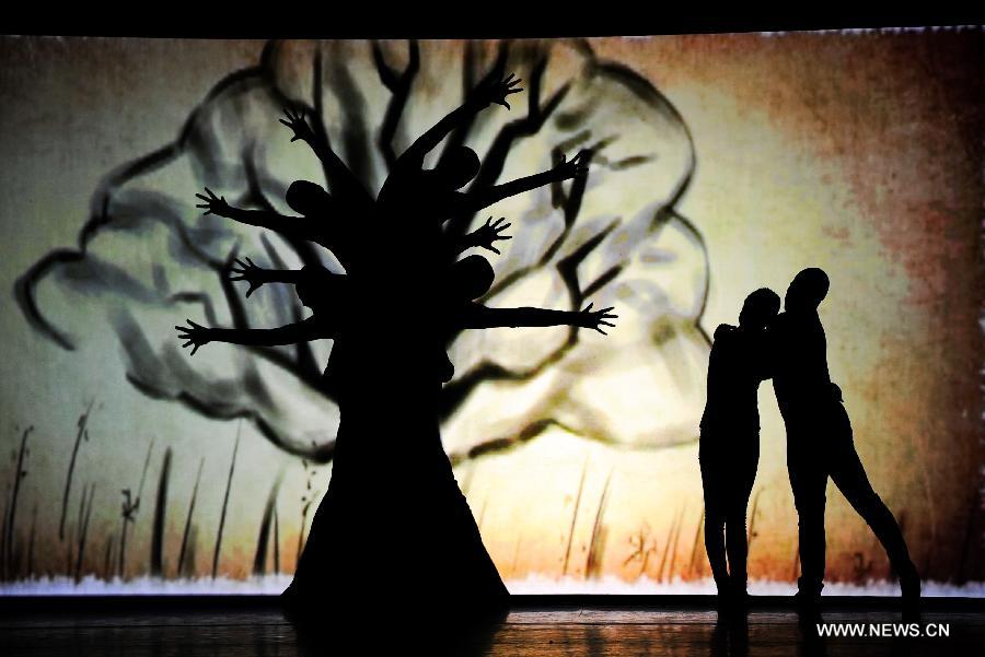 Artists of the Jilin Provincial Performing Troupe perform during a stage show at the Oriental Theatre in Changchun, capital of northeast China's Jilin Province, April 22, 2013. The show, with various art forms including singing, dancing, acrobatics and conjuring, displays folk customs in the Changbai Mountain area. (Xinhua/Xu Chang) 