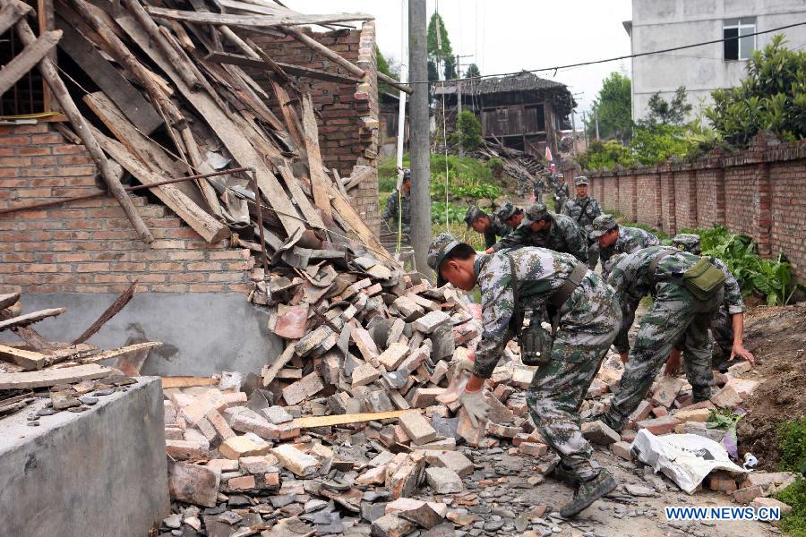 Rescuers clear the debris in quake-hit Longmen Township of Lushan County, southwest China's Sichuan Province, April 21, 2013. A 7.0-magnitude quake jolted Lushan County of Ya'an City on Saturday morning. (Xinhua/Gao Xiaowen)