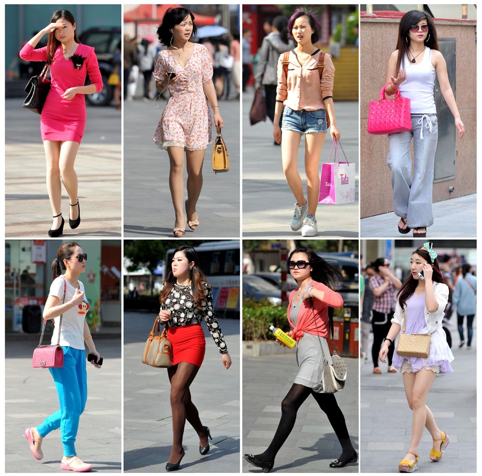 Young girls in summer dresses walk on the streets in Nanjing. The temperature reached 31 degrees Celsius on April 15, 2013. (Photo/Xinhua) 