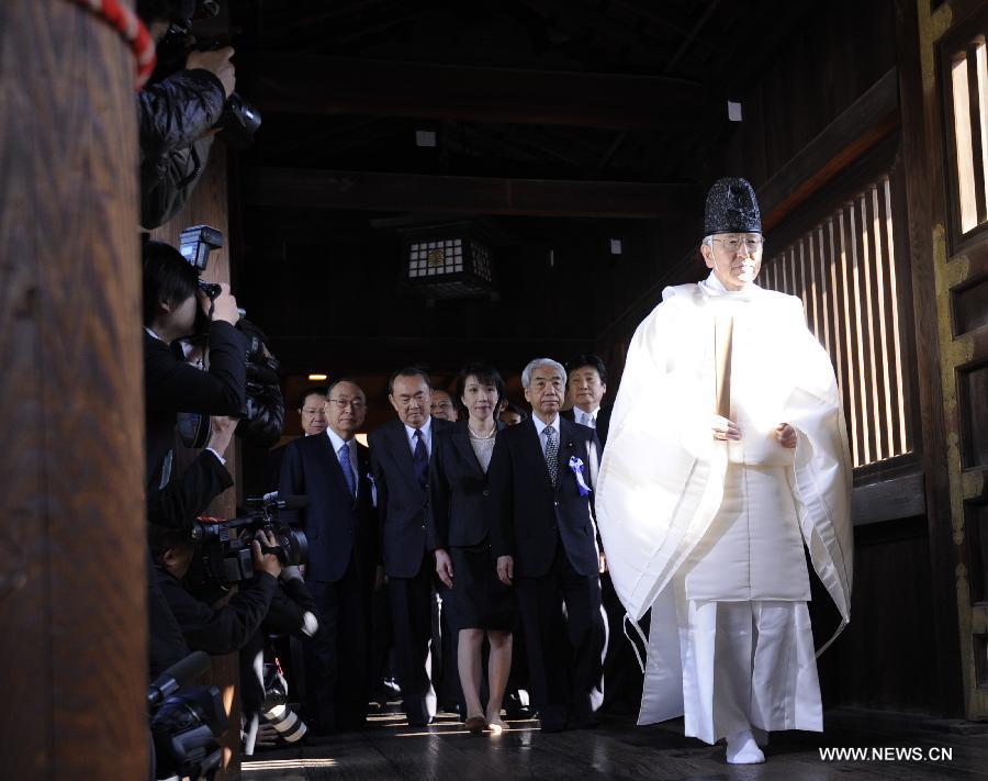 Japanese lawmakers head to visit the Yasukuni Shrine in Tokyo, Japan, on April 23, 2013. Despite repeated strong opposition from China, a group of 168 Japanese lawmakers on Tuesday visited the controversial war-link Yasukuni Shrine in Tokyo, which honors Japanese war criminals of World War II. It marked the first time that the Japanese lawmakers' number exceeded 100 since October 2005, according to local media. (Xinhua) 