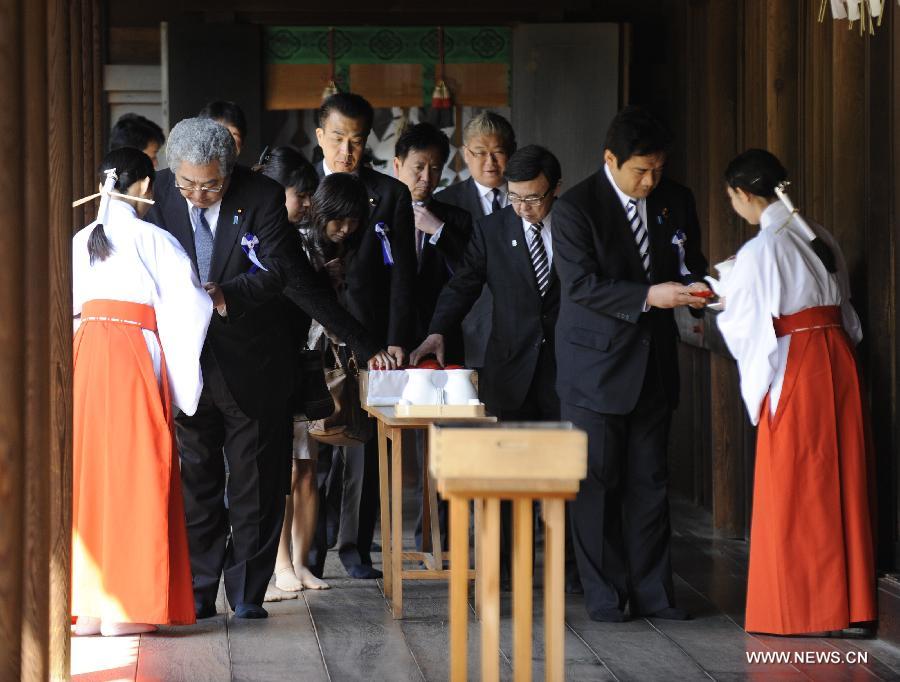 Japanese lawmakers are ready to leave after visiting the Yasukuni Shrine in Tokyo, Japan, on April 23, 2013. Despite repeated strong opposition from China, a group of 168 Japanese lawmakers on Tuesday visited the controversial war-link Yasukuni Shrine in Tokyo, which honors Japanese war criminals of World War II. It marked the first time that the Japanese lawmakers' number exceeded 100 since October 2005, according to local media. (Xinhua) 