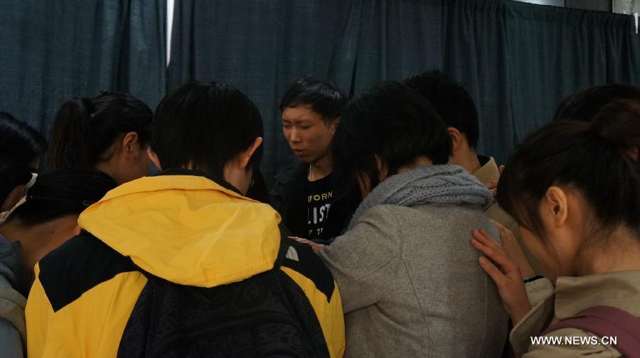 Boston bombing victim Lu Lingzi's schoolmates attend her memorial service at Boston University in Boston, the United States, on April 22, 2013. Lu Lingzi, a Boston University student from China, was killed in the deadly Boston Marathon explosions on April 15. (Xinhua/Han Youjia)