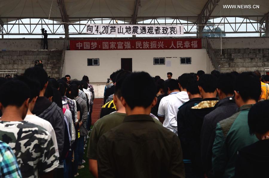 Teachers and students mourn for those who died in a 7.0-magnitude quake a week ago, at Lushan Middle School in Lushan County, southwest China's Sichuan Province, April 27, 2013. Public mourning was held on Saturday morning in Sichuan Province for those who died in a 7.0-magnitude quake a week ago. The earthquake hit Lushan County of Sichuan Province on April 20 and has claimed nearly 200 lives. (Xinhua/Jin Liangkuai)