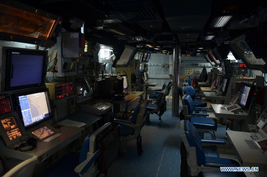 Combat Information Centre (CIC) on board is seen inside the U.S. Navy guided-missile cruiser USS Lake Champlain during a media presentation in North Vancouver, Canada, on April 27, 2013. Approximately 1,000 Canadian and American sailors are in Vancouver to meet the public and media to bring the Navy to the Canadians. (Xinhua/Sergei Bachlakov)