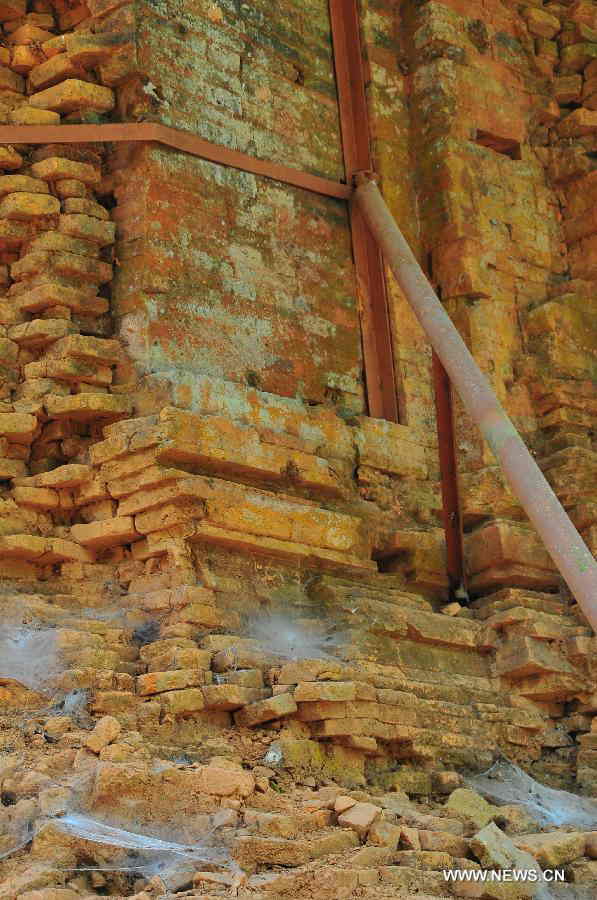 Reinforced structures in My Son Sanctuary, which was badly wrecked during last century's Vietnam War, are seen in central Vietnam, on April 29, 2013. Between the 4th and 13th centuries, a unique culture which owed its spiritual origins to Indian Hinduism developed on the coast of contemporary Vietnam. It was graphically illustrated by the remains of a series of impressive tower-temples located in My Son that was the religious and political capital of the Champa Kingdom for most of its existence. My Son Sanctuary was inscripted in UNESCO's World Cultural Heritage list in 1999. (Xinhua/Zhang Jianhua) 