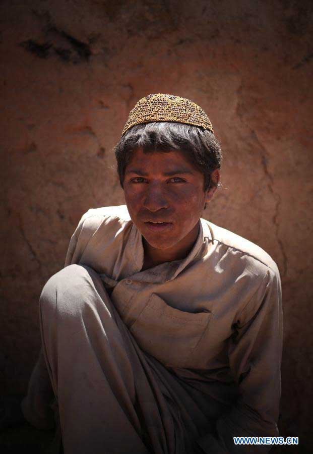 An Afghan labor poses for a picture on the International Labor Day in Kabul, Afghanistan on May 1, 2013. (Xinhua/Ahmad Massoud)