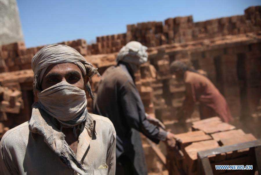 Afghan labors work on the International Labor Day in Kabul, Afghanistan on May 1, 2013. (Xinhua/Ahmad Massoud)