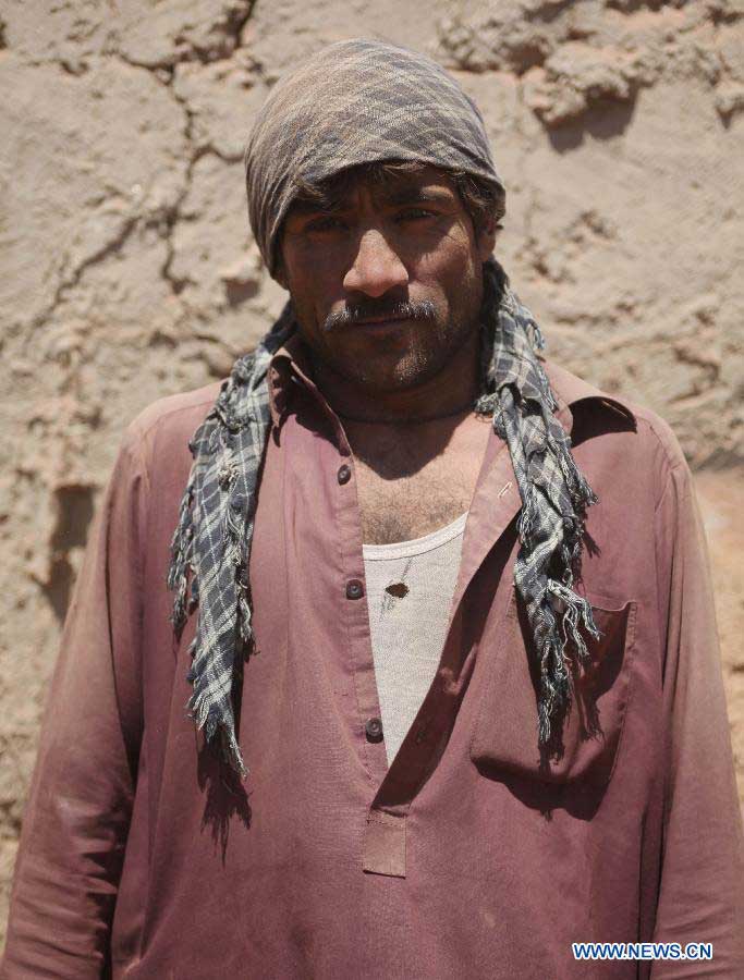 An Afghan labor poses for a picture on the International Labor Day in Kabul, Afghanistan on May 1, 2013. (Xinhua/Ahmad Massoud)