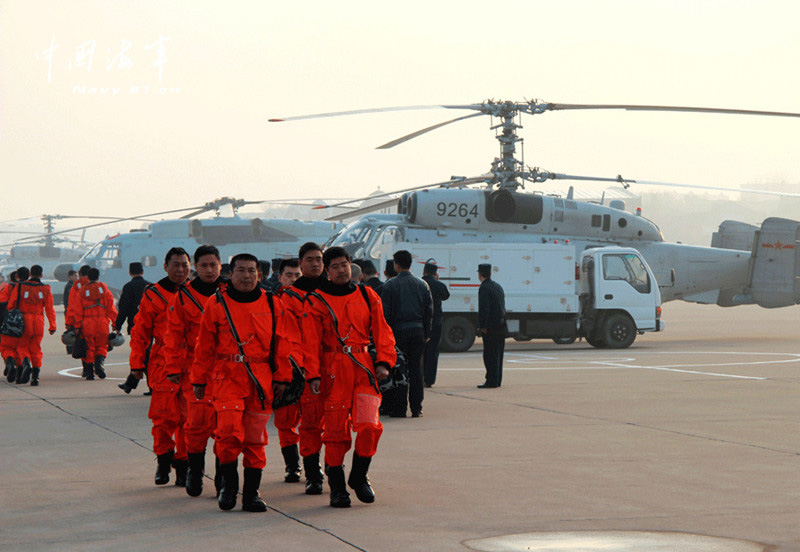 Ship-borne helicopters are in anti-submarine drills in the Yellow Sea under complicated weather conditions. (China Military Online)