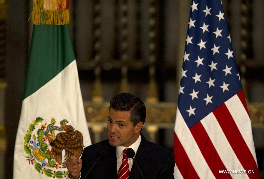 Mexican President Enrique Pena Nieto speaks during a joint press conference with U.S. President Barack Obama after a bilateral meeting at the National Palace in Mexico City, capital of Mexico, on May 2, 2013. Obama visits Mexico to meet with Pena Nieto and analyze matters concerning education, infrastructure, commerce, migration and security, according to the local press. (Xinhua/David de la Paz) 