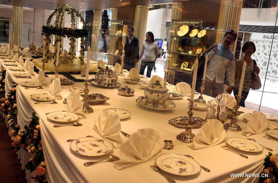 Visitors view tableware during an exhibition of "Splendour of the French Table" in Hong Kong, south China, May 4, 2013. As one of the activities of "French May", the exhibition which will last till June 9 presents tableware from leading French historical manufactures and luxury maisons since the 18th century. (Xinhua/Li Peng) 