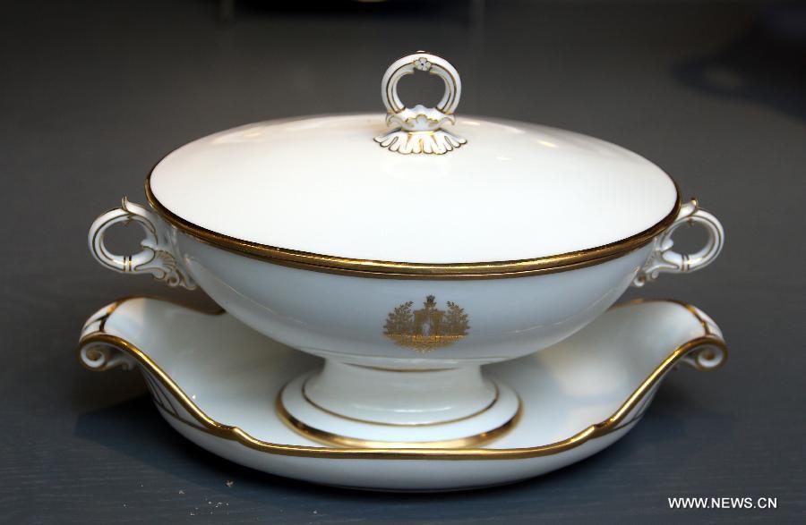 Photo taken on May 4, 2013 shows a porcelain candy jar made in 1838 displayed in an exhibition of "Splendour of the French Table" in Hong Kong, south China. As one of the activities of "French May", the exhibition which will last till June 9 presents tablewarefrom leading French historical manufactures and luxury maisons since the 18th century. (Xinhua/Li Peng) 