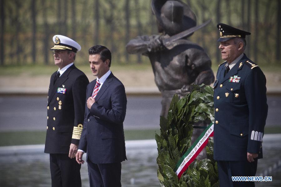 Mexico's President Enrique Pena Nieto (C), Secretary of National Defense Salvador Cienfuegos (R) and Secretary of Navy Vidal Francisco Soberon Sanz (L) stand guard at the General Ignacio Zaragoza Mausoleum during the celebrations of 151st anniversary of the Battle of Puebla, in the city of Puebla, Mexico, on May 5, 2013. The Battle of Puebla took place on May 5, 1862 near the city of Puebla during the French intervention in Mexico. The Mexican victory is celebrated yearly on May 5. (Xinhua/Rodrigo oropeza)