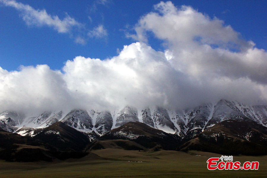 Photo taken in early May shows snow-capped mountains beside Sayram Lake in Bortala Mongol Autonomous Prefecture, Northwest China's Xinjiang Uyghur Autonomous Region. Sayram Lake is the largest and highest alpine lake in Xinjiang, about 20km long from east to west, 30km wide from north to south and 90.5 meters deep at the greatest depth. It occupies an area of 457 square kilometers, with the holding capacity of 21 billion cubic meters. (CNS/Wang Tiesuo)