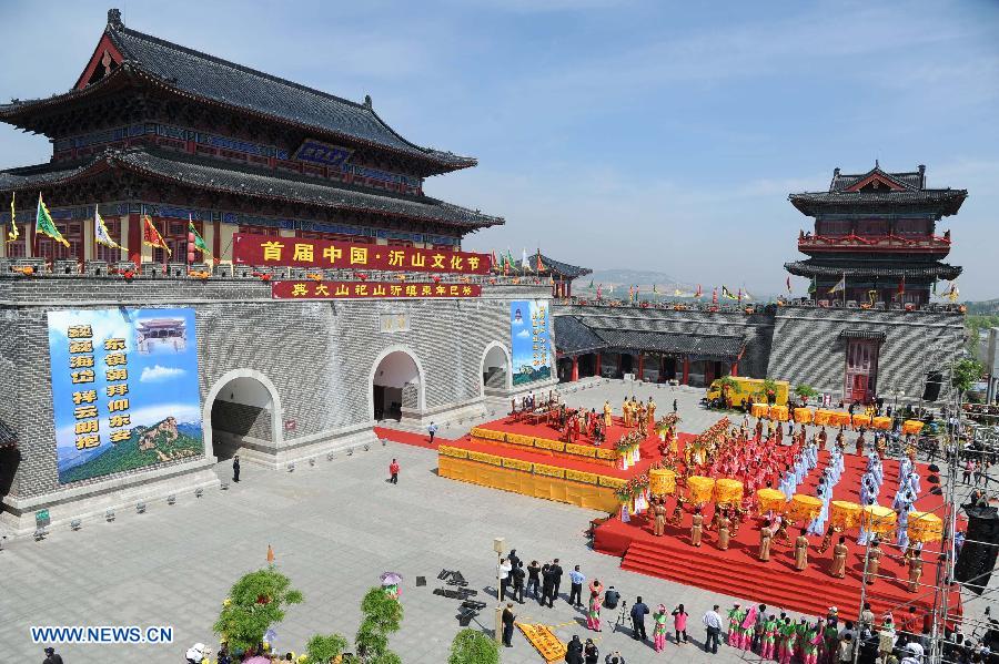 Performers attend a traditional ceremony praying for peace and prosperity during the first Qishan Cultural Festival in the Qishan scenic spot in Linqu County, east China's Shandong Province, May 7, 2013. (Xinhua/Sun Shubao) 