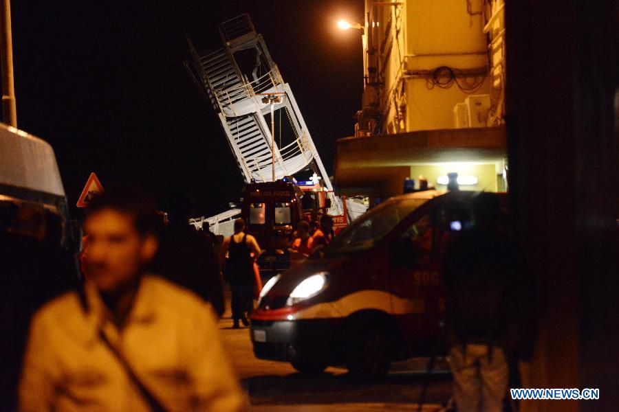 Rescuers work around the ruins of the control tower in the port of Genoa, northern Italy.  (Xinhua/Davide Pambianchi)