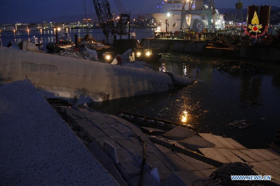 This photo released by Italian Vigili del Fuoco (Italian fire service) shows rescuers working at the ship accident site at north Italy's Genoa port on May 8, 2013. The death toll of the Italian ship's accident in the northern Genoa port rose to seven late on Wednesday while more were injured or missing. Divers were still searching bodies trapped in the underwater rubble of a 50-meter-tall control tower that was demolished by the container ship Jolly Nero on Tuesday night. The ship, 239 meters long and with a gross tonnage of nearly 40,600 tonnes, suddenly crashed into the concrete and glass tower while maneuvering out the port in calm conditions. (Xinhua/Italian Vigili del Fuoco)