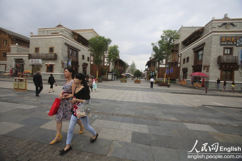 Photo taken on May 2, 2013 shows the residential and commercial area in the new Beichuan county. The new Biechuan county was rebuilt on a rape field and became the youngest county in China. (Photo/CFP) 