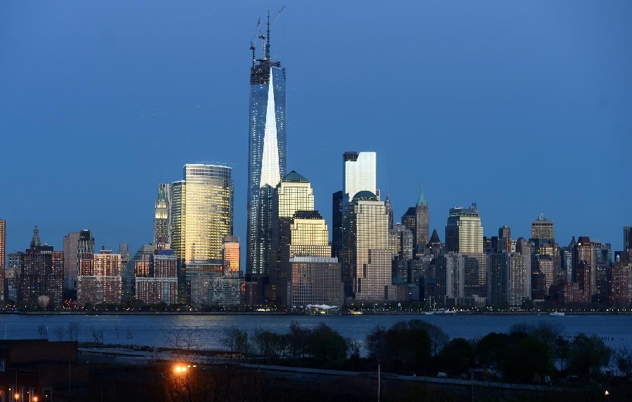 Filed photo taken on May 1, 2013 shows the night view of One World Trade Center (WTC) in New York. Workers have installed the final sections of the silver spire atop WTC on Friday, which brings the iconic New York City structure to its full, symbolic height of 1,776 feet (541 meters). (Xinhua/Wang Lei) 