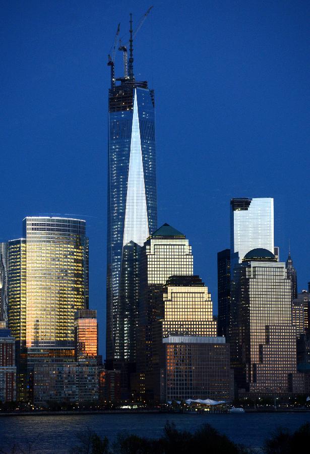 Filed photo taken on May 1, 2013 shows the night view of One World Trade Center (WTC) in New York. Workers have installed the final sections of the silver spire atop WTC on Friday, which brings the iconic New York City structure to its full, symbolic height of 1,776 feet (541 meters). (Xinhua/Wang Lei) 