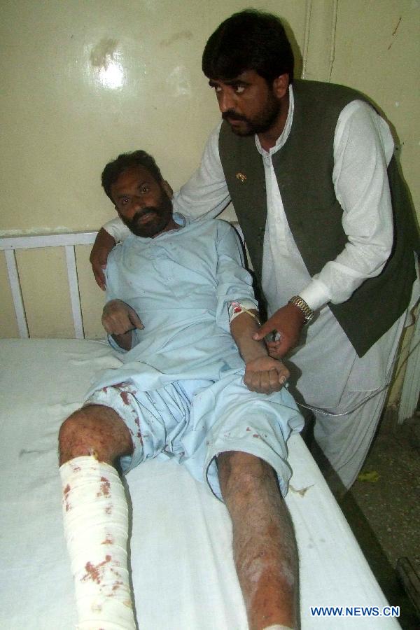 An injured man receives medical treatment at a hospital in southwest Pakistan's Quetta on May 10, 2013. Five people were injured in an explosion near an election campaign office of Pakistan Peoples Party located in Quetta on Friday. (Xinhua/Asad)