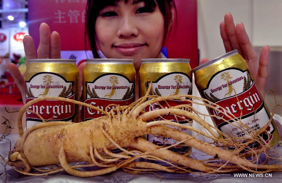 A Korean exhibitor displays a kind of ginseng beer at the 15th International Exhibition of Food & Drink, Hotel, Restaurant & Food Service Equipment, Supplies & Services (HOFEX) in south China's Hong Kong, May 10, 2013. The four-day HOFEX 2013 kicked off on May 7 at Hong Kong Convention & Exhibition Center. (Xinhua/Chen Xiaowei)