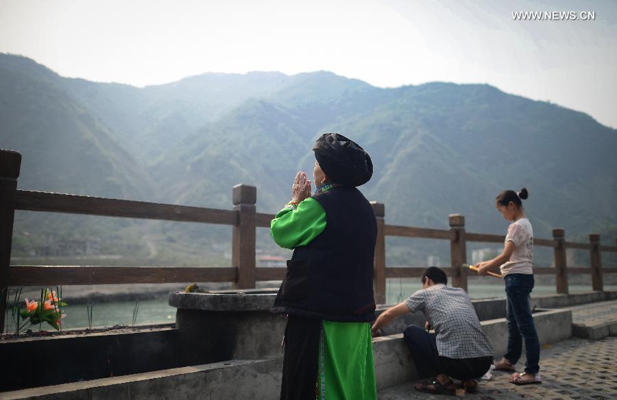 People mourn for deceased family members in the Wenchuan Earthquake in Beichuan County, southwest China's Sichuan Province, May 11, 2013. Many people returned to the Beichuan county to mourn for the dead as Sunday marks the fifth anniversary of the 8-magnitude quake that rocked Sichuan Province in 2008. (Xinhua/Jiang Hongjing) 