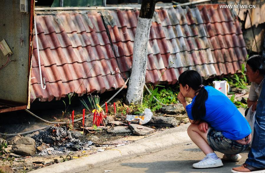 People mourn for deceased family members in the Wenchuan Earthquake in Beichuan County, southwest China's Sichuan Province, May 11, 2013. Many people returned to the Beichuan county to mourn for the dead as Sunday marks the fifth anniversary of the 8-magnitude quake that rocked Sichuan Province in 2008. (Xinhua/Jiang Hongjing) 