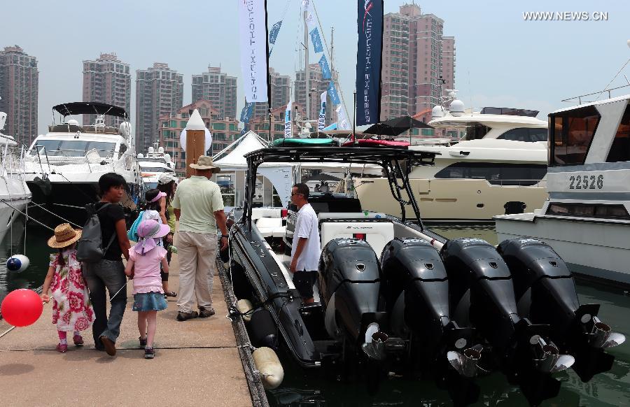 Photo taken on May 11, 2013 shows yachts at an exhibition held by the Gold Coast Yacht Country Club in Hong Kong, south China. The exhibition has attracted 70 exhibitors around the world with their luxurious yachts as well as a fancy lifestyle at sea. (Xinhua/Li Peng) 