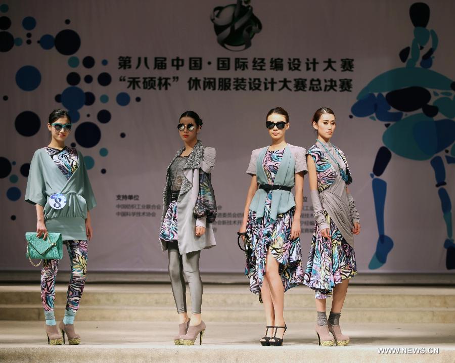 Models present creations made of warp knitted fabric during the 8th China International Knitting Design Awards in Shanghai, east China, May 11, 2013. (Xinhua/Shen Da) 