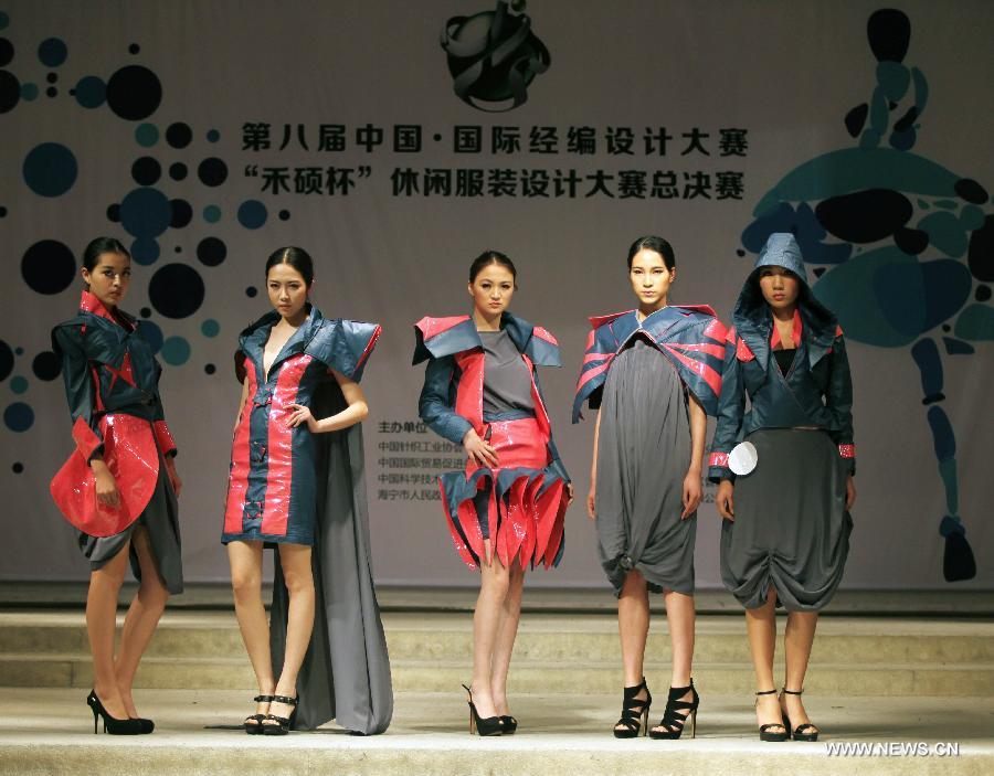 Models present creations made of warp knitted fabric during the 8th China International Knitting Design Awards in Shanghai, east China, May 11, 2013. (Xinhua/Shen Da) 