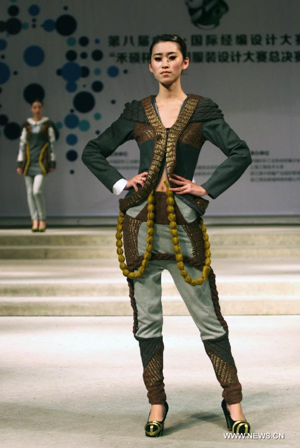 A model presents a creation made of warp knitted fabric during the 8th China International Knitting Design Awards in Shanghai, east China, May 11, 2013. (Xinhua/Shen Da) 