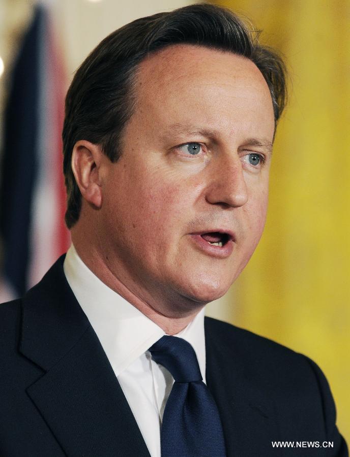 British Prime Minister David Cameron speaks during a joint press conference with U.S. President Barack Obama following their talks at the White House in Washington D.C. on May 13, 2013. (Xinhua/Fang Zhe)