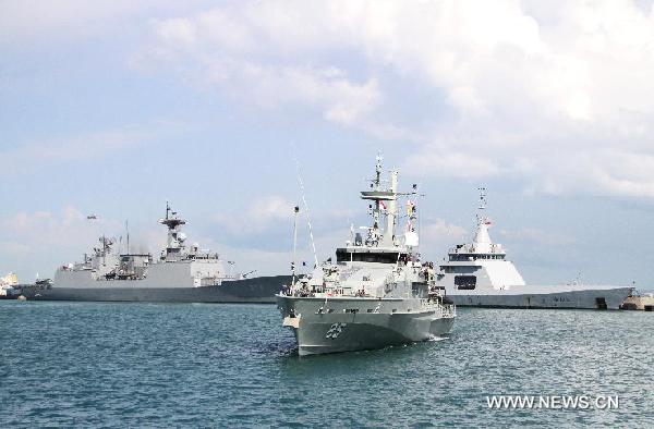 An Australian warship approaches at Singapore's Changi Naval Base, May 13, 2013. Warships from Australia, France, India, Indonesia, South Korea and Singapore docked at Singapore's Changi Naval Base for display as part of the upcoming International Maritime Defense Exhibition Asia in Singapore on May 14 to 16. (Xinhua/Hu Juanxin)