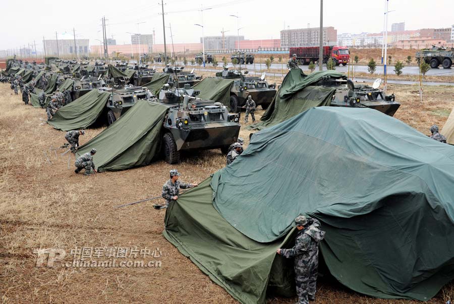 A division under the Beijing Military Area Command (MAC) of the Chinese People's Liberation Army (PLA) organized its officers and men to conduct a long-distance maneuver drill on May 8, 2013, so as to improve troops' command and control as well as support capabilities under actual-combat conditions. (Chinamil.com.cn/Cheng Jianfeng)