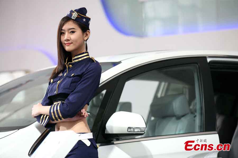 A model presents a car at the 2013 Qingdao International Auto Show, which kicks off in Qingdao, a coastal city in East China's Shandong Province, May 14, 2013. (CNS/Xu Chongde)