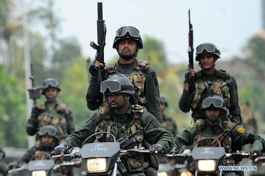 Sri Lankan army personnel march during the Victory Day parade rehearsal in Colombo, capital of Sri Lanka, on May 15, 2013. Sri Lanka celebrates War Heroes Week with a military parade scheduled for May 18. The parade celebrates the fourth anniversary of the defeat of the Tamil Tiger rebels in May 2009, ending a 37-year long separatist conflict. (Xinhua/Pushpika Karunaratne)