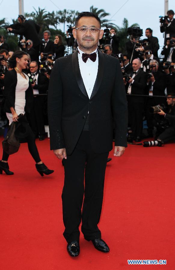 Chinese actor Jiang Wu arrives on the red carpet for the opening ceremony of the 66th annual Cannes Film Festival in Cannes, France, May 15, 2013. The festival runs from May 15 to 26. (Xinhua/Gao Jing)