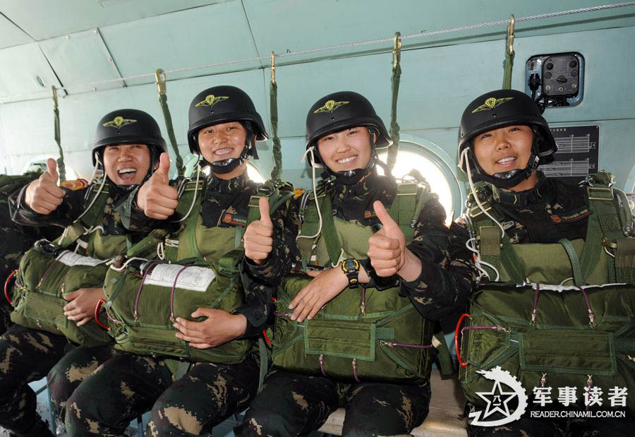 The members from the first female special operation company of the Army of the Chinese People's Liberation Army (PLAA) are in their first parachute landing training on May 14, 2013. (China Military Online/Cheng Jianfeng, Yan Xingxing)