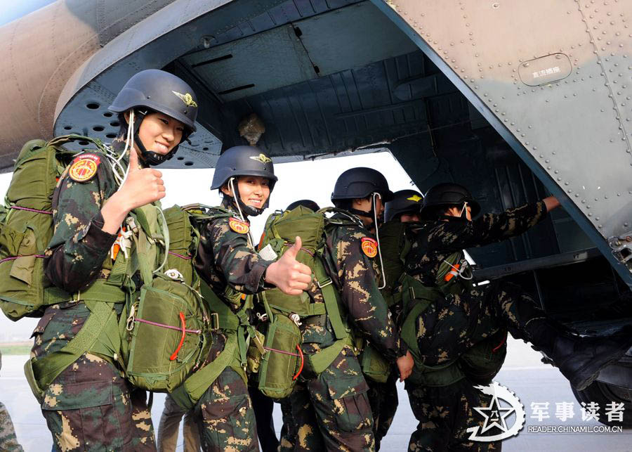 The members from the first female special operation company of the Army of the Chinese People's Liberation Army (PLAA) are in their first parachute landing training on May 14, 2013. (China Military Online/Cheng Jianfeng, Yan Xingxing)