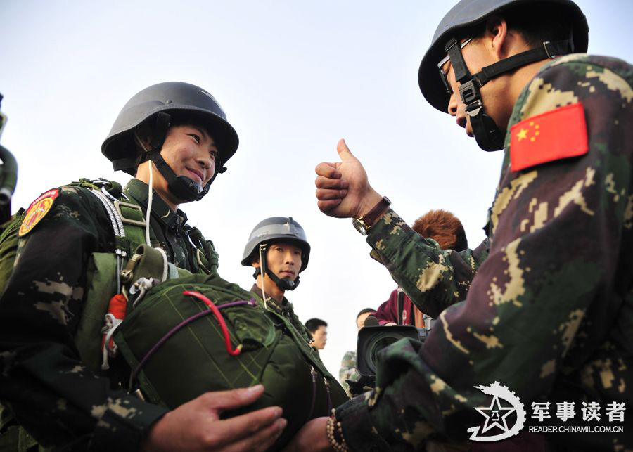 The members from the first female special operation company of the Army of the Chinese People's Liberation Army (PLAA) are in their first parachute landing training on May 14, 2013. (China Military Online/Cheng Jianfeng, Yan Xingxing)