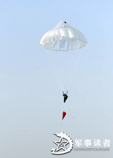 A member from the first female special operation company of the Army of the Chinese People's Liberation Army (PLAA) are in their first parachute landing training on May 14, 2013. (China Military Online/Cheng Jianfeng, Yan Xingxing)