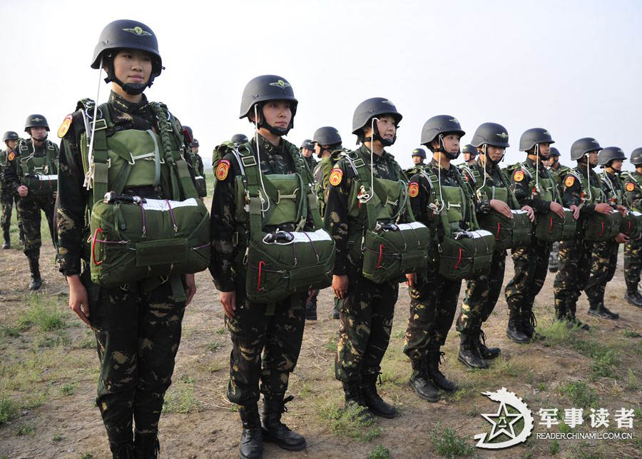 The members from the first female special operation company of the Army of the Chinese People's Liberation Army (PLAA) are in their first parachute landing training on May 14, 2013. (China Military Online/Cheng Jianfeng, Yan Xingxing)