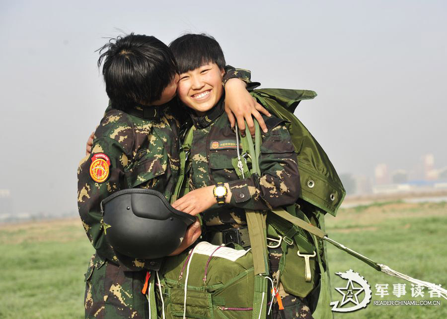 The members from the first female special operation company of the Army of the Chinese People's Liberation Army (PLAA) are in their first parachute landing training on May 14, 2013. (China Military Online/Cheng Jianfeng, Yan Xingxing)